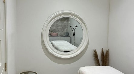 Tranquil treatment room at Body Secrets - West London, showcasing a massage table in London, England, GB.