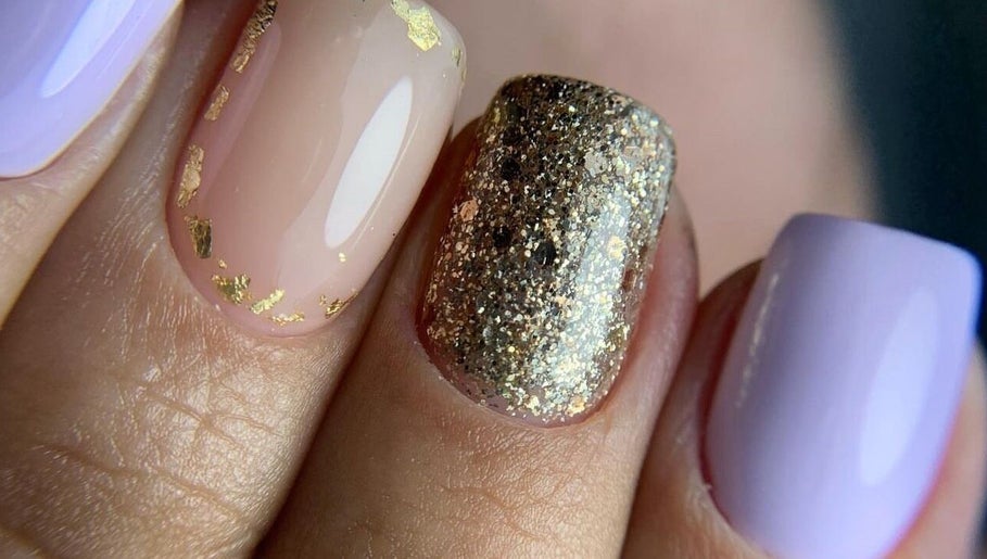 Elegant nail art with gold and glitter at Special Nails Clinic, Deerfield Beach, Florida, US.