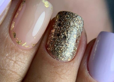 Elegant nail art with gold and glitter at Special Nails Clinic, Deerfield Beach, Florida, US.