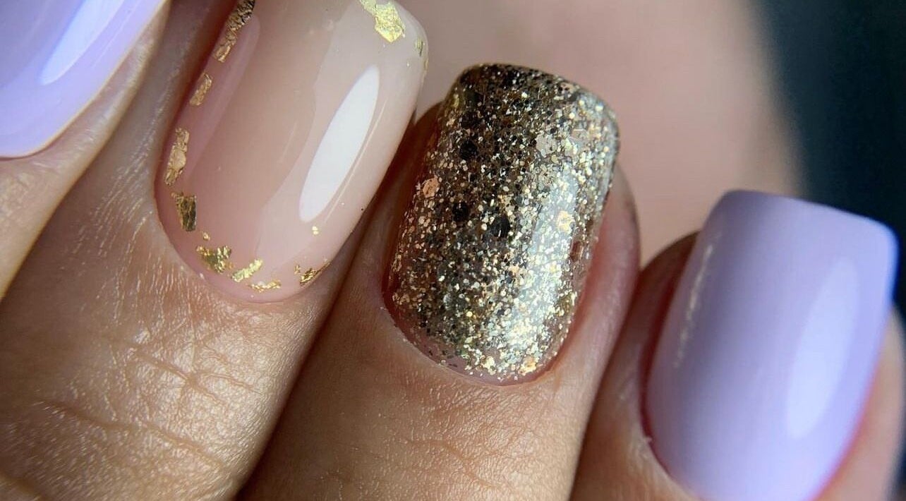 Elegant nail art with gold and glitter at Special Nails Clinic, Deerfield Beach, Florida, US.