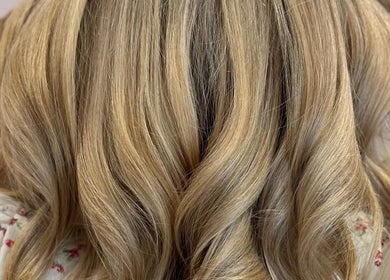 Blonde hair styled in waves at Hair by Katrina The Hair Barn, Hereford, England, GB.