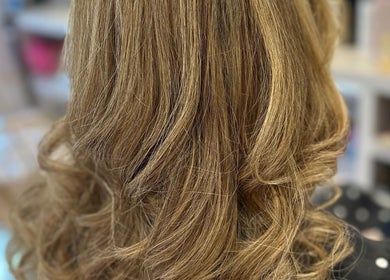 Elegant curled hairstyle at Hair by Katrina The Hair Barn, Hereford, England, GB showcasing stunning waves.