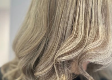 Lustrous blonde waves styled at Hair by Katrina The Hair Barn in Hereford, England, GB.