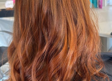 Vibrant red hair styled at Hair by Katrina The Hair barn, Hereford, England, GB. Beautifully crafted waves.