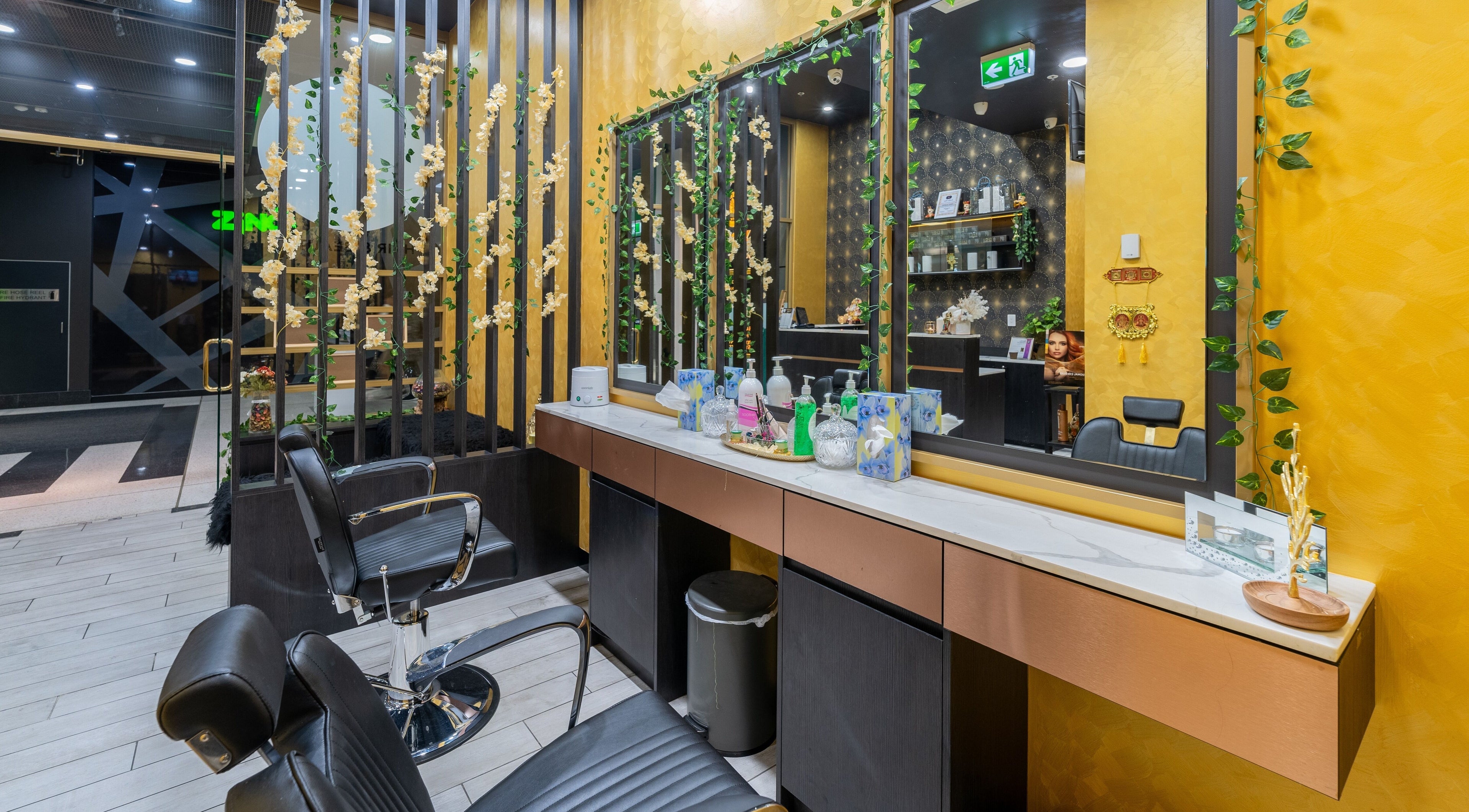 Exotic Indian Beauty - Blacktown salon's elegant interior with black chairs and vibrant decor, Blacktown, New South Wales, AU