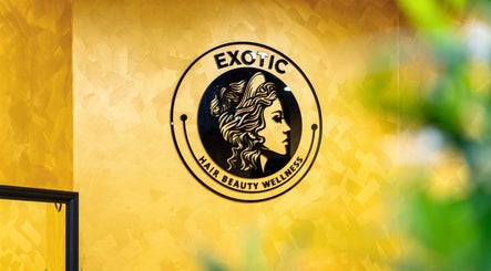 Logo of Exotic Indian Salon Richmond on a textured yellow wall in Richmond, New South Wales, AU.