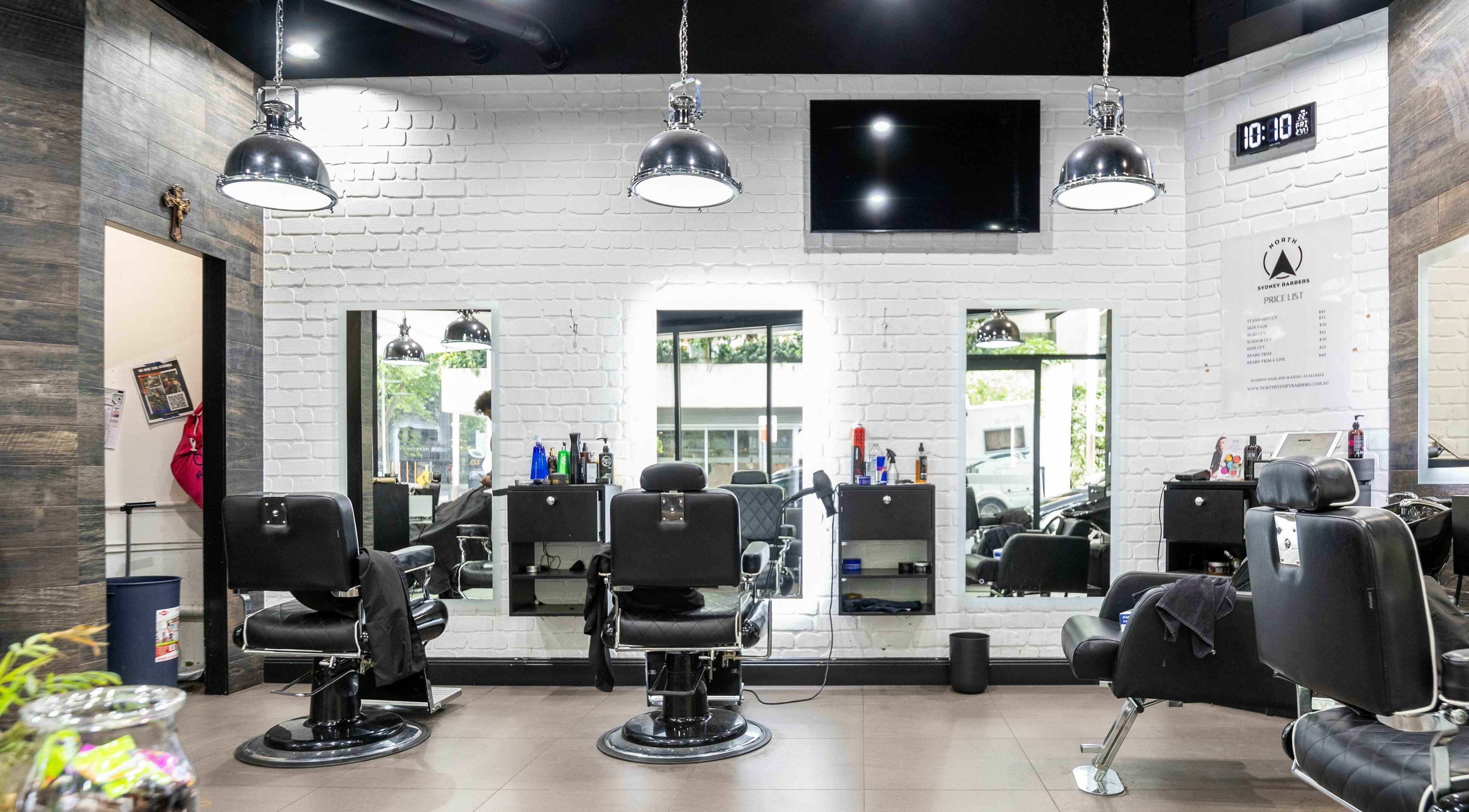 Interior of North Sydney Barbers showcasing sleek chairs and mirrors, North Sydney, New South Wales, AU.