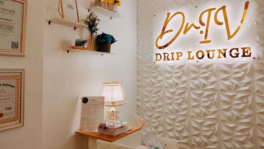 Stylish interior of Dr. IV Drip Lounge, Dumaguete, Central Visayas, PH, featuring elegant decor and signage.