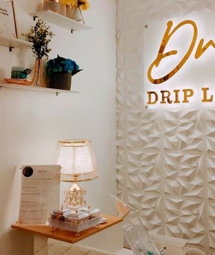 Stylish interior of Dr. IV Drip Lounge, Dumaguete, Central Visayas, PH, featuring elegant decor and signage.