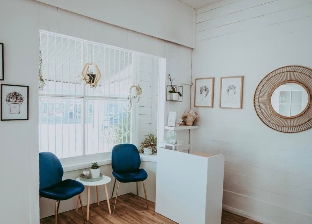 Inviting reception area at Oh My Skin Gunnedah, New South Wales, AU, with blue chairs and elegant decor.