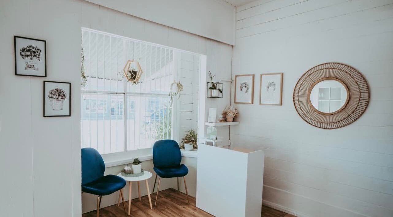 Inviting reception area at Oh My Skin Gunnedah, New South Wales, AU, with blue chairs and elegant decor.