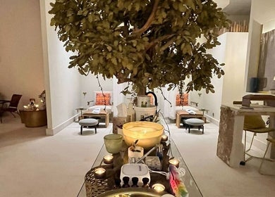 Relaxing interior at La Femme Salon & Nail Spa, Al Khobar, Eastern Province, SA, showcasing spa seating and candles.