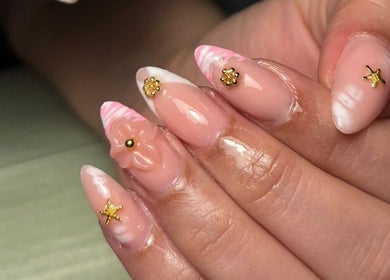 Elegant nail art with floral designs at La Femme Salon & Nail Spa, Al Khobar, Eastern Province, SA.