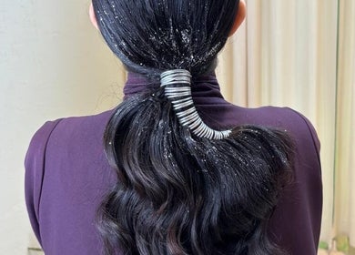 Elegant ponytail with glitter details at La Femme Salon & Nail Spa, Al Khobar, Eastern Province, SA.