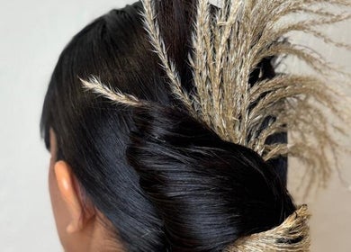 Sophisticated updo with decorative accents at La Femme Salon & Nail Spa, Al Khobar, Eastern Province, SA.