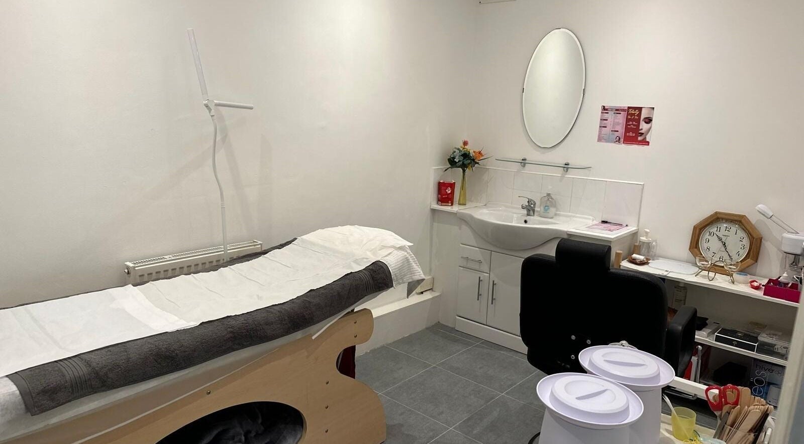 Sleek treatment room at Totally Tips and Toes in London, England, GB, featuring a bed and modern amenities.