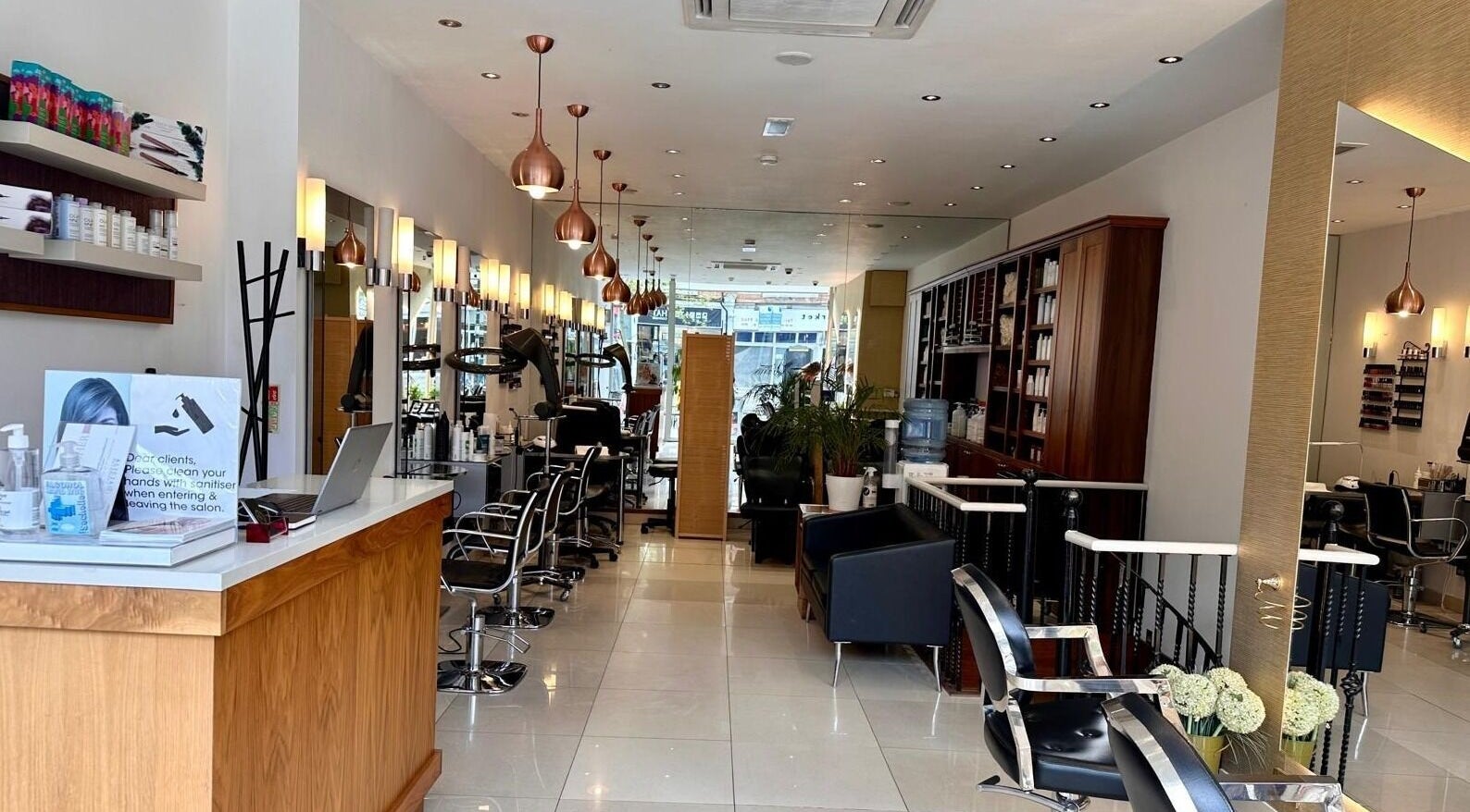 Elegant interior of Alicia Hair and Beauty, London, England, GB, showcasing modern salon setup with luxury decor.