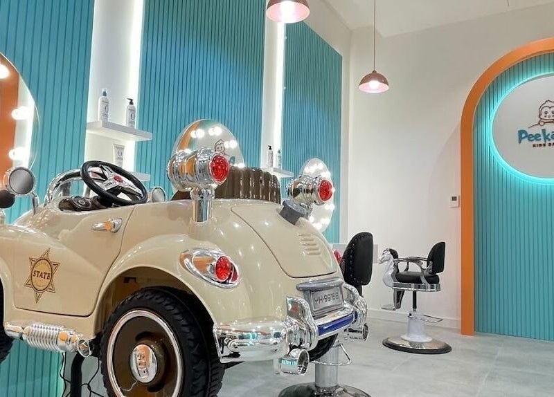 Fun car chair at Peekaboo Kids Salon Mall Of Oman, مسقط, محافظة مسقط, OM. Perfect for a delightful haircut experience.