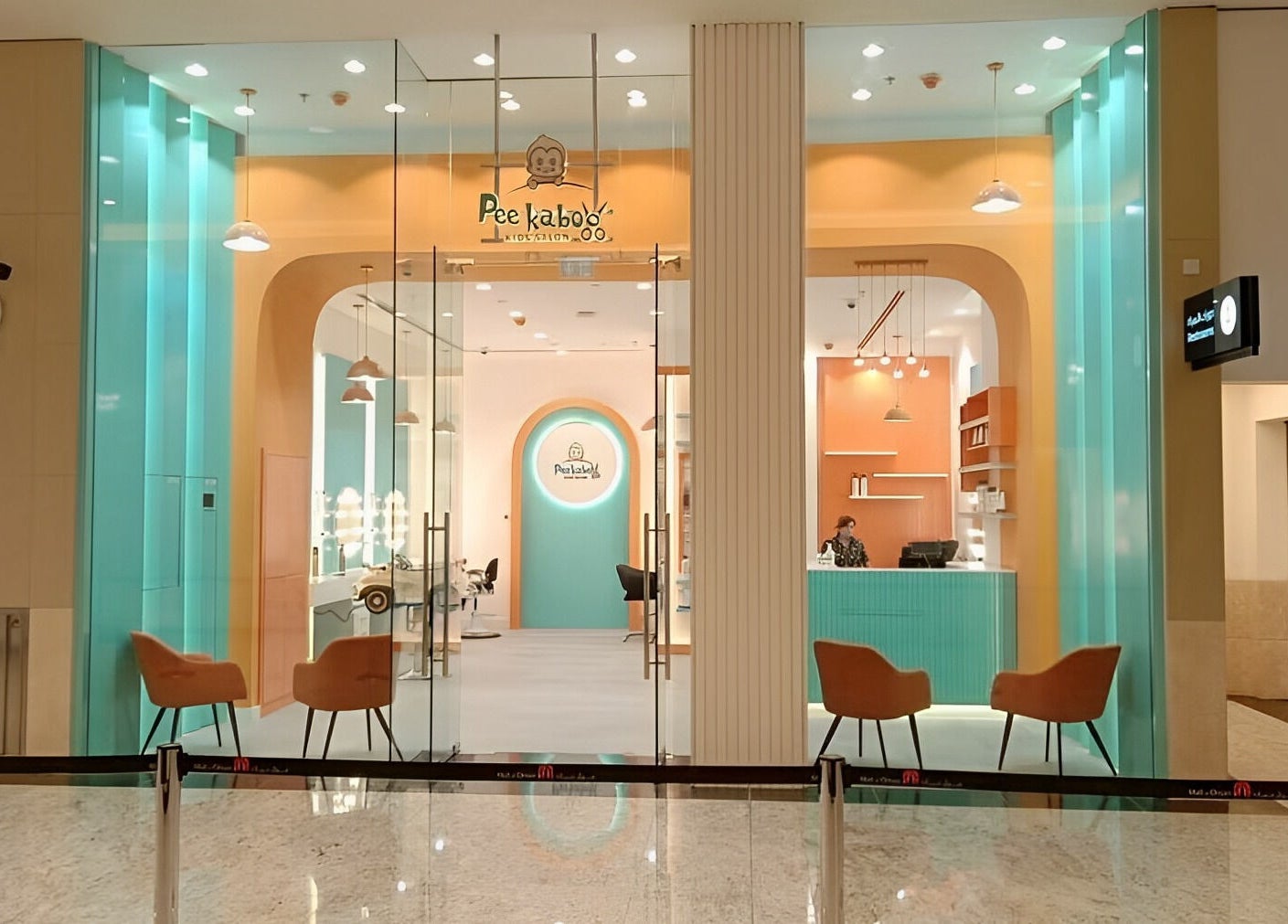 Bright entrance of Peekaboo Kids Salon Mall Of Oman, مسقط, محافظة مسقط, OM with colorful decor and seating.