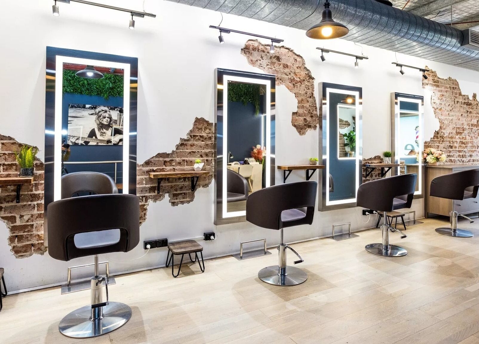 Evoke Hair Salon Rosebery in Rosebery, New South Wales, AU features stylish industrial decor with exposed brick walls.