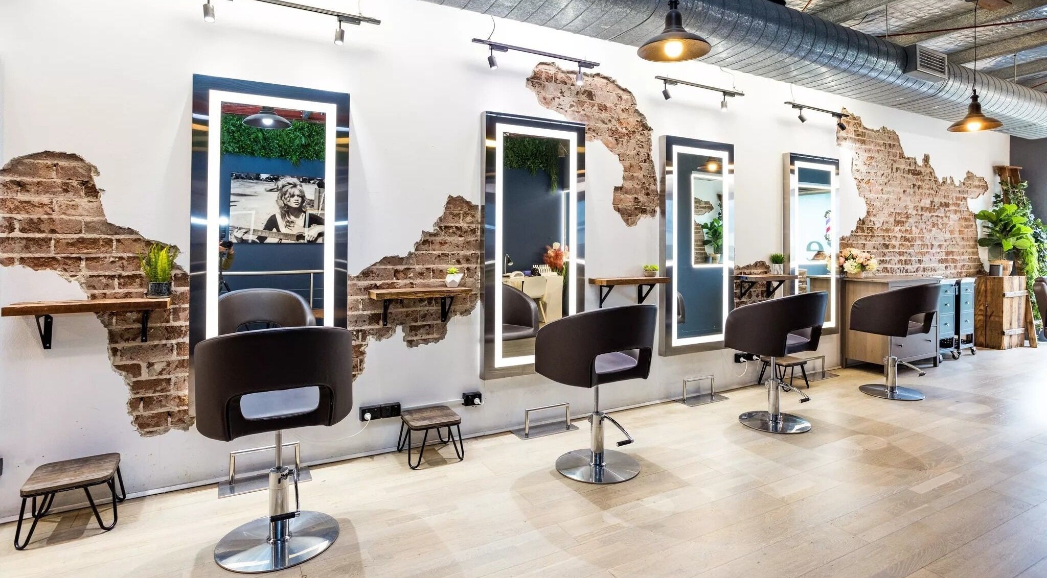 Evoke Hair Salon Rosebery in Rosebery, New South Wales, AU features stylish industrial decor with exposed brick walls.