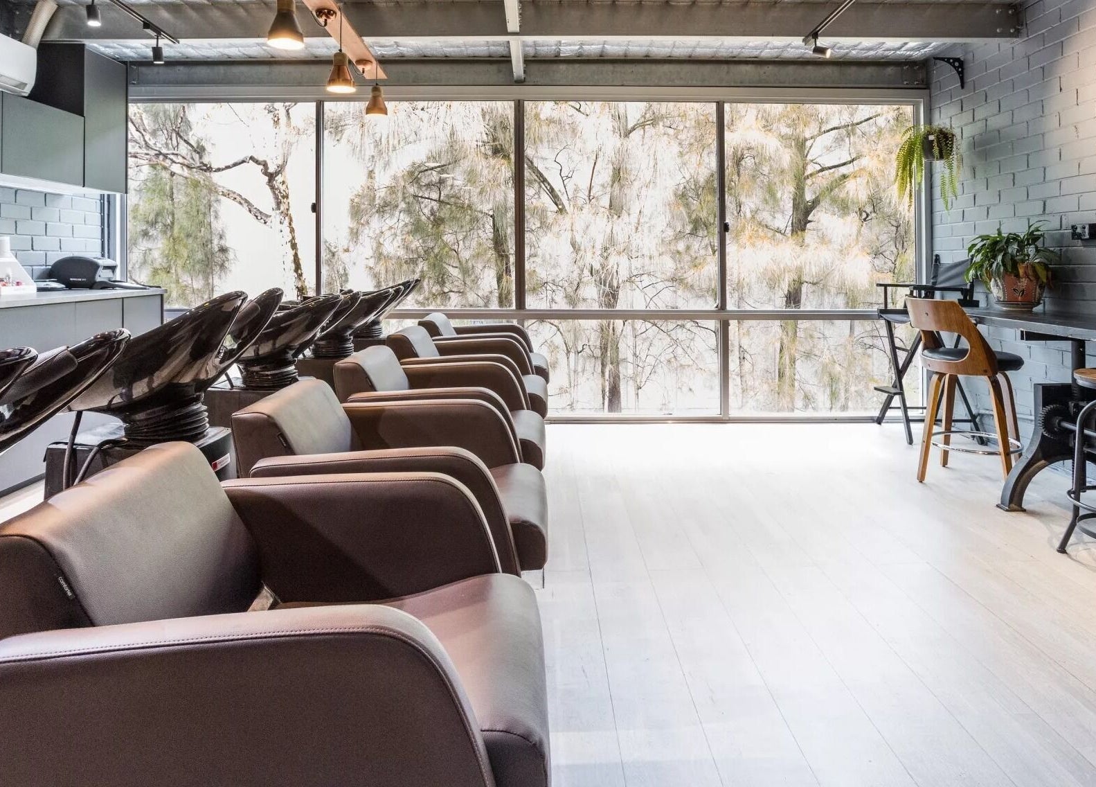 Evoke Hair Salon Rosebery features sleek styling chairs in Rosebery, New South Wales, AU.