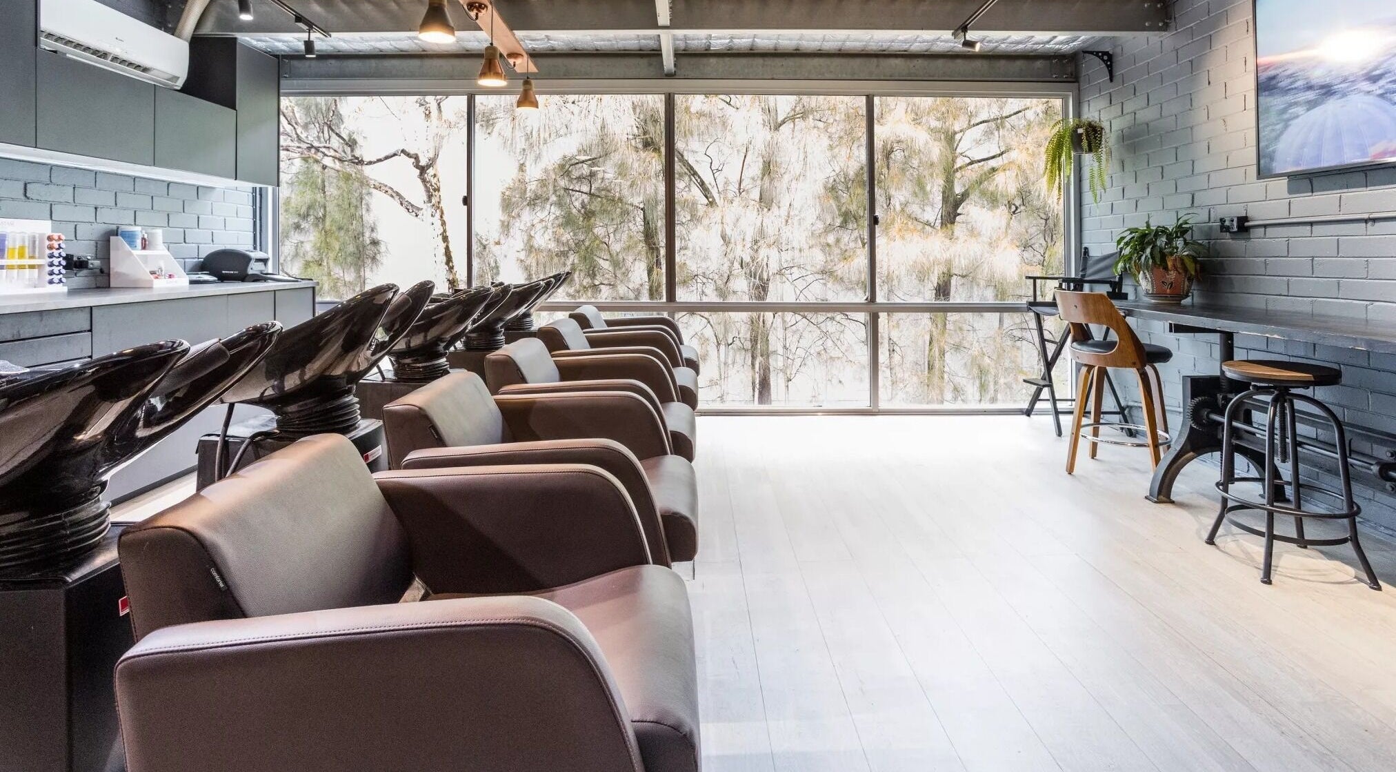 Evoke Hair Salon Rosebery features sleek styling chairs in Rosebery, New South Wales, AU.