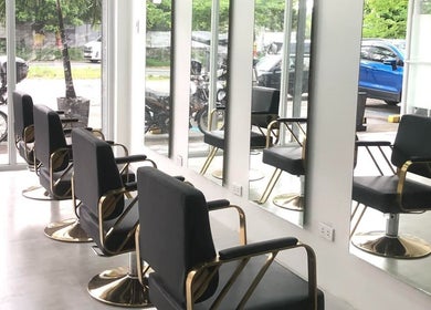 Modern salon chairs at CJ Hair Lounge, Angeles, Central Luzon, PH, reflecting a sleek, contemporary design.