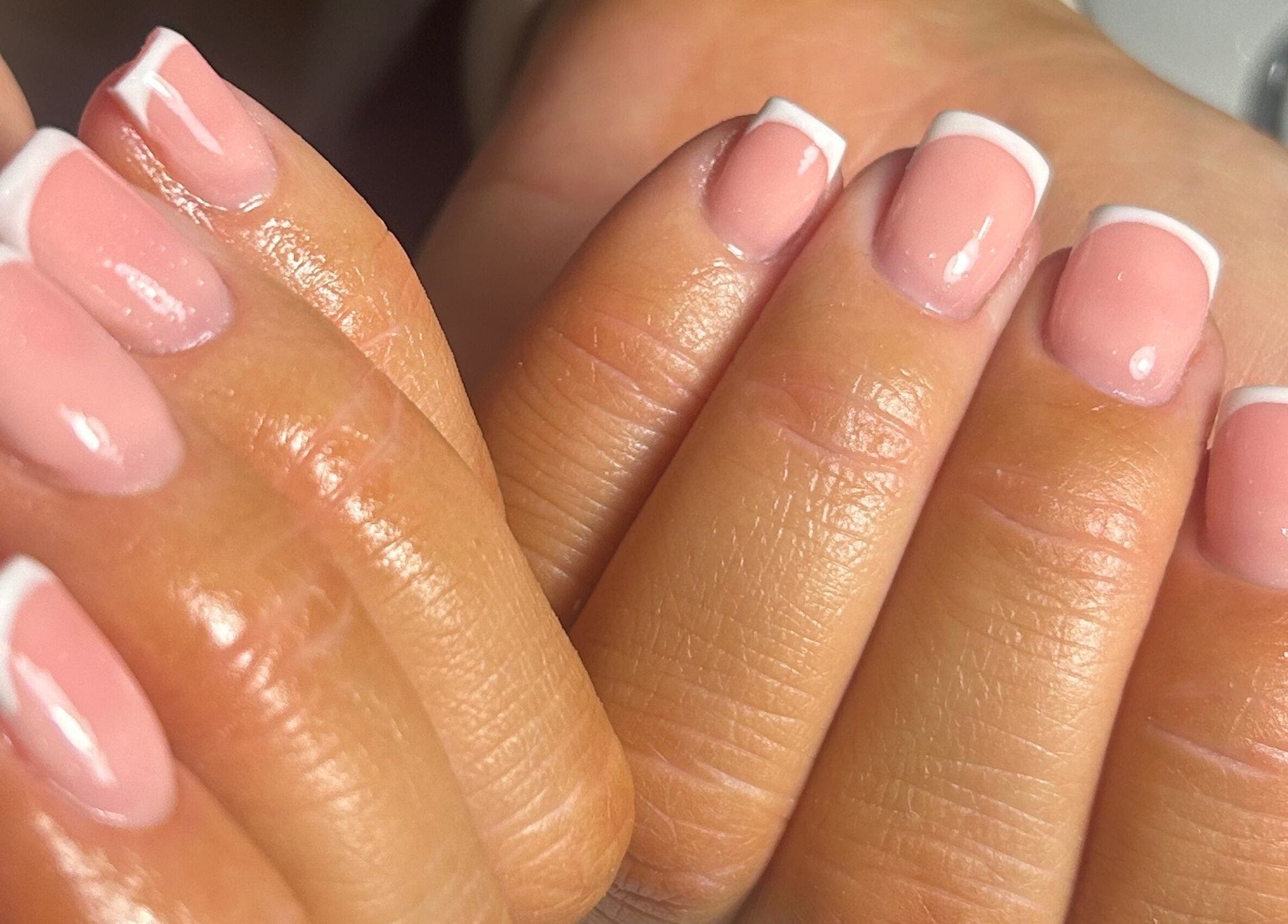 Elegant French manicure at Nail Babe By Sophie in Nottingham, England, GB showcasing glossy pink nails.