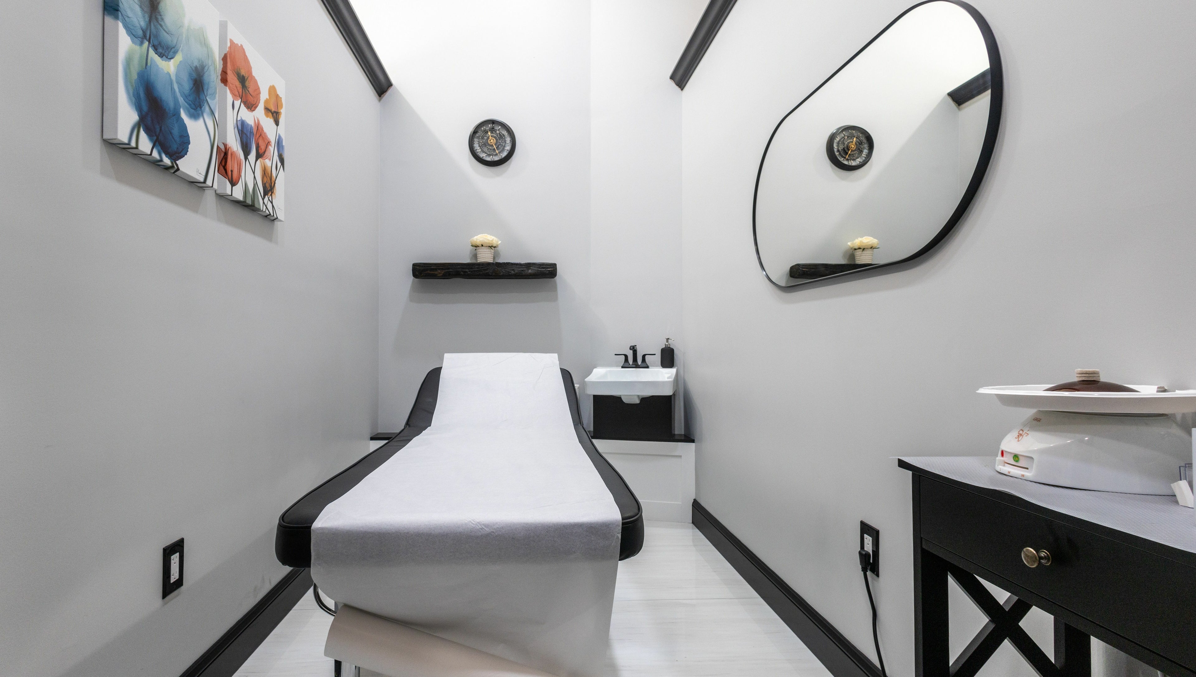 Relaxing treatment room at Top Nails Spa II in Closter, New Jersey, US, featuring modern decor and a massage bed.