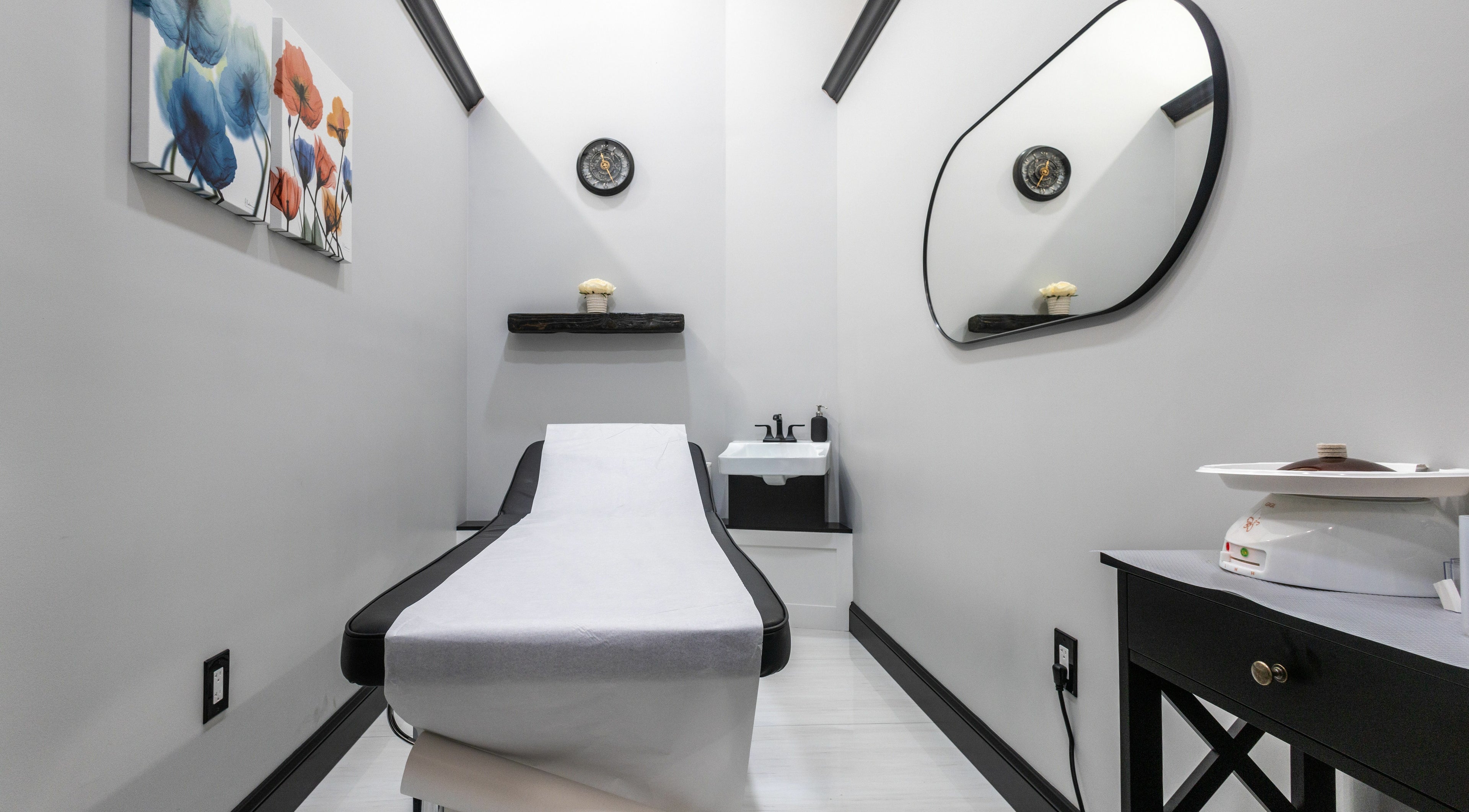 Relaxing treatment room at Top Nails Spa II in Closter, New Jersey, US, featuring modern decor and a massage bed.