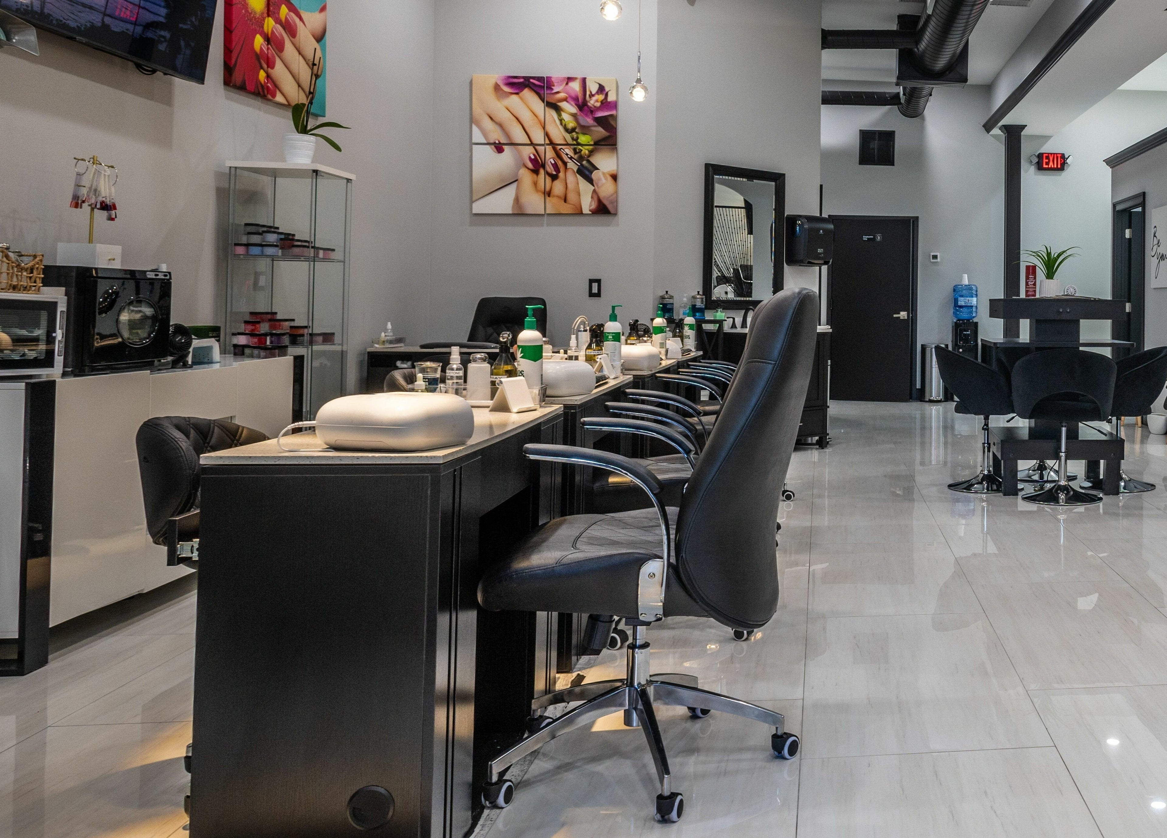 Modern interior of Top Nails Spa II in Closter, New Jersey, US showcasing sleek nail stations.