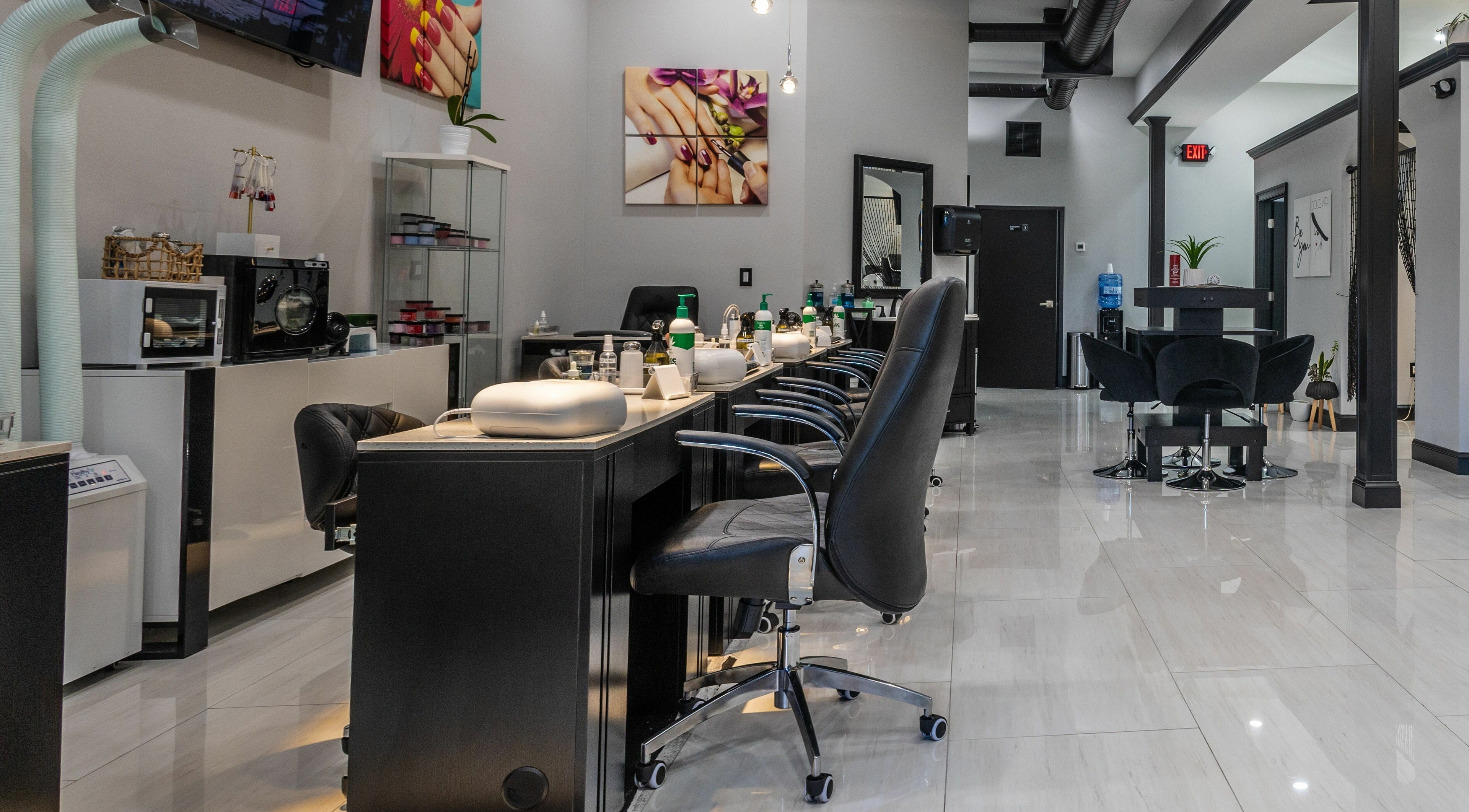 Modern interior of Top Nails Spa II in Closter, New Jersey, US showcasing sleek nail stations.