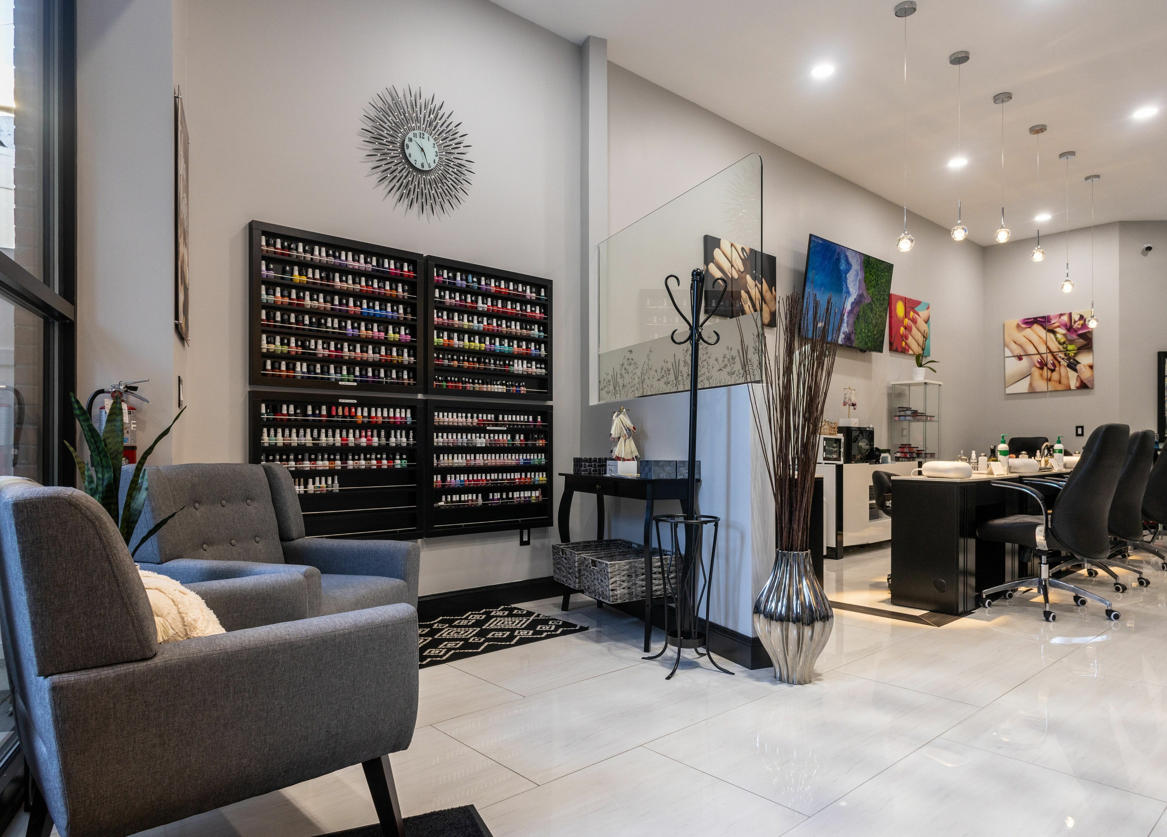 Elegant interior of Top Nails Spa ll in Closter, New Jersey, US with manicure stations and vibrant decor.