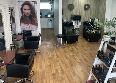 Modern interior of Kut Loose Hairdesign Robe, featuring styling stations and products in Robe, South Australia, AU.