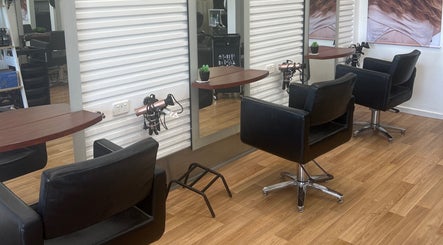Stylish salon chairs and mirrors at Kut Loose Hairdesign Robe, Robe, South Australia, AU.