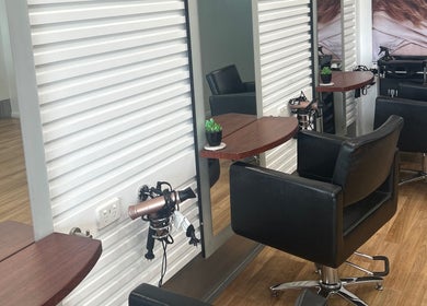 Interior of Kut Loose Hairdesign Robe, featuring modern styling stations in Robe, South Australia, AU.