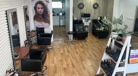 Modern salon interior at Kut Loose Hairdesign Robe, Robe, South Australia, AU featuring elegant styling chairs.