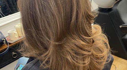 Chic haircut at Miles Rhodes Hair Stylist, displaying styled hair in Bath, England, GB salon.