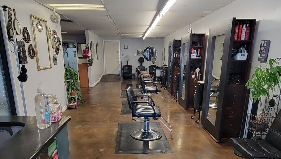 Modern interior of Hair Care Center in Burbank, California, US with sleek styling chairs and mirrors.
