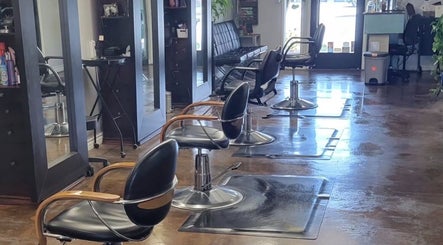 Stylish interior of Hair Care Center in Burbank, California, US with modern salon chairs and mirrors.