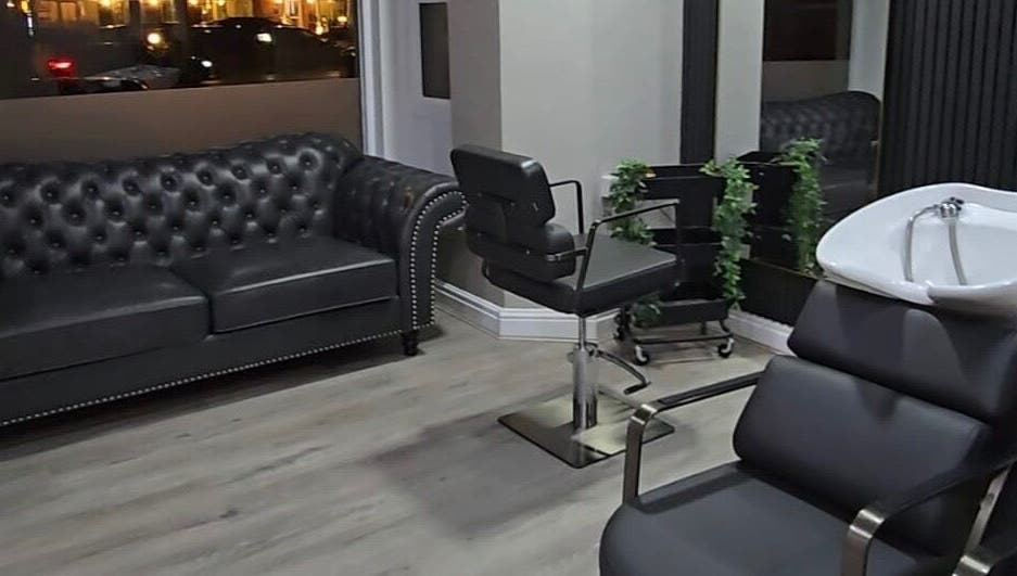 Modern salon interior at Professional Enhancements, Lytham St Annes, England, GB with sleek furniture and decor.