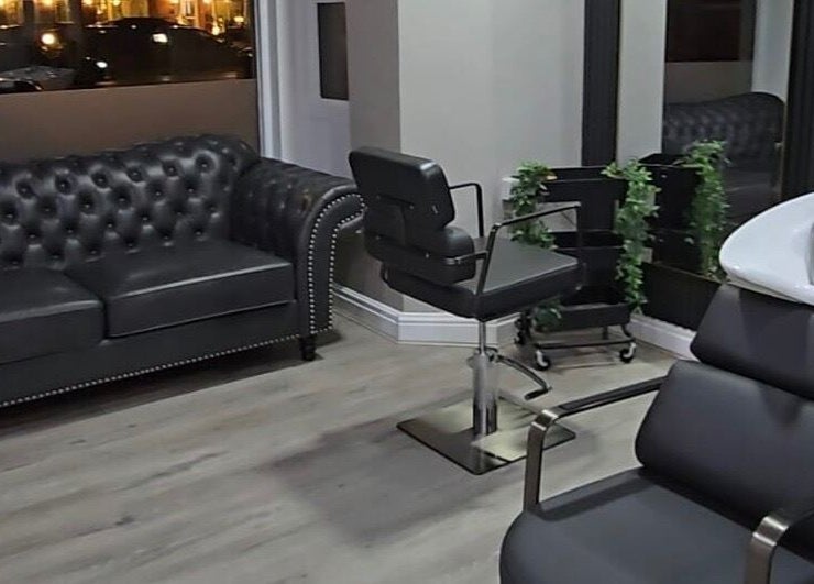 Modern salon interior at Professional Enhancements, Lytham St Annes, England, GB with sleek furniture and decor.