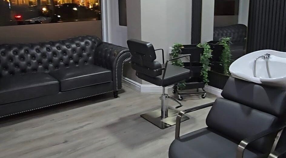 Modern salon interior at Professional Enhancements, Lytham St Annes, England, GB with sleek furniture and decor.