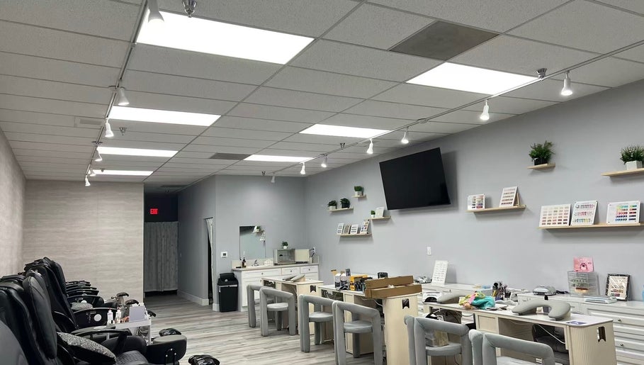 Modern interior of Y2 Nail Salon in Ontario, California, US featuring stylish nail stations and cozy seating.