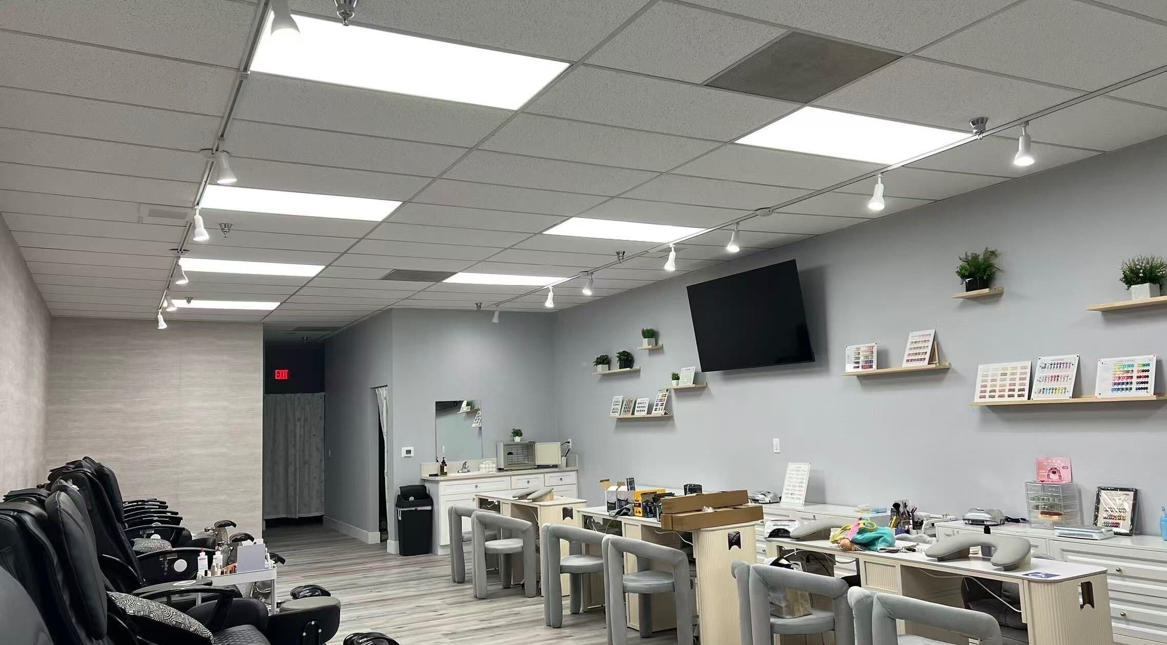 Modern interior of Y2 Nail Salon in Ontario, California, US featuring stylish nail stations and cozy seating.