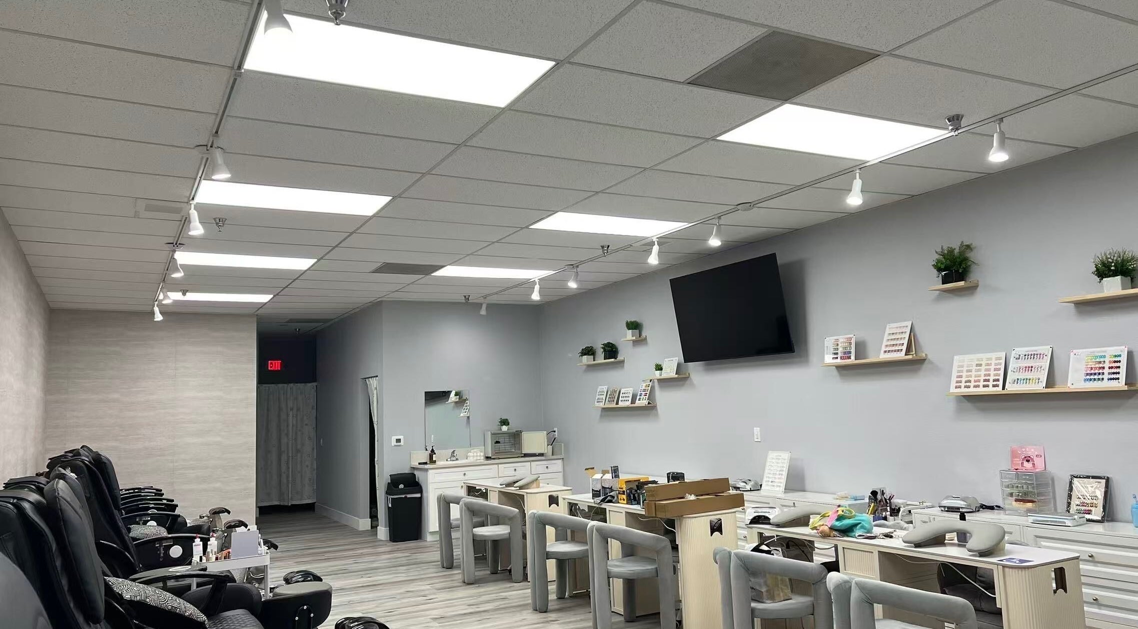 Modern interior of Y2 Nail Salon in Ontario, California, US featuring stylish nail stations and cozy seating.