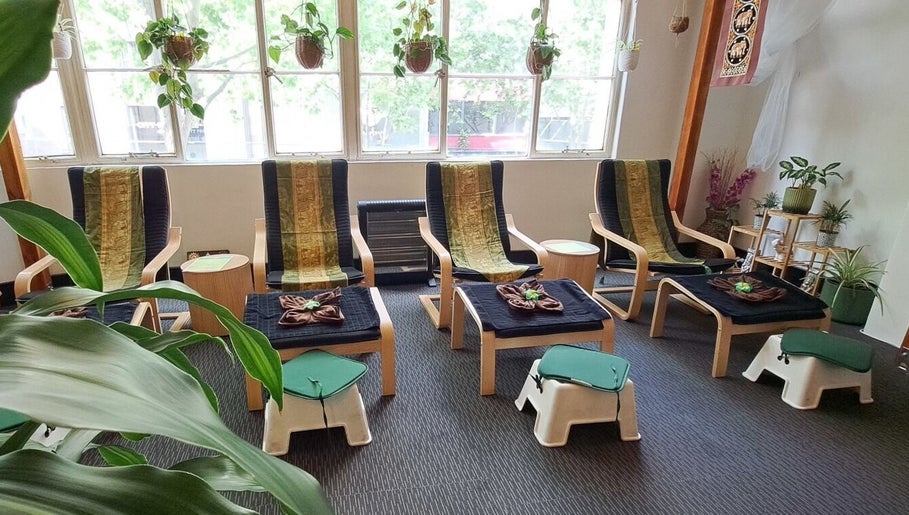 Relaxation chairs at Acacia Thai Massage, Melbourne, Victoria, AU, offering a peaceful ambiance with lush greenery.