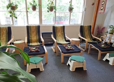 Relaxation chairs at Acacia Thai Massage, Melbourne, Victoria, AU, offering a peaceful ambiance with lush greenery.