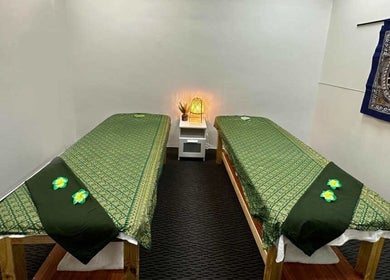 Relaxing massage room at Acacia Thai Massage, Melbourne, Victoria, AU, with soothing decor and twin beds.